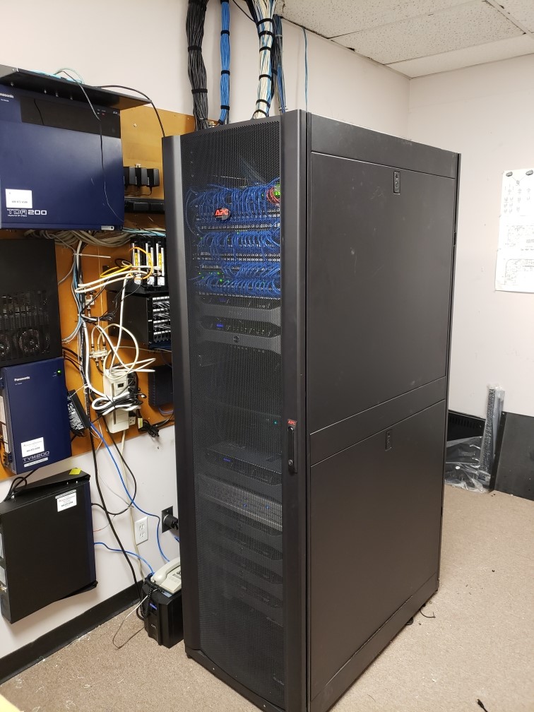 Closed, organized server rack after a Capilano Communications rack cleanup